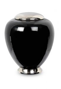 Black cremation urn made from cast brass with silver lid