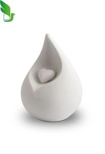 Small teardrop-shaped biodegradable urn ‘Celest’ with heart