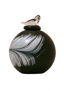 Glass cremation urn with bird and feather