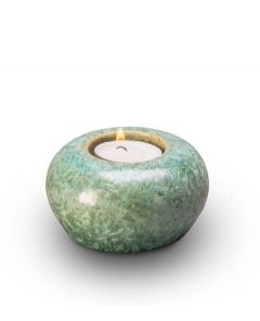 Ceramic keepsake cremation ashes urn with a candle