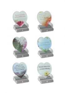 Heart shaped memorial marker with several designs on glass plate