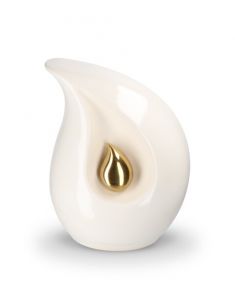 Teardrop cremation urn for ashes made of white ceramic with small gold-coloured teardrop