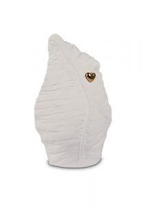 Leaf shaped cremation ashes urn with golden heart