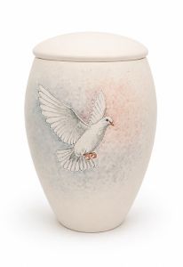 Hand-painted cremation urn with white dove in flight