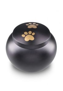 pet urn for ashes matte black with 2 gold-coloured paw prints in various sizes