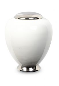White cremation urn made from cast brass with silver lid