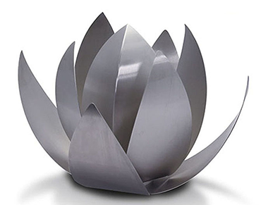 Metal outdoor urn for ashes in a garden