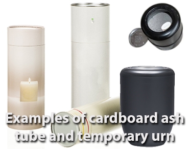 Cardboard tube and plastic ash container as examples for filling a cremation urn